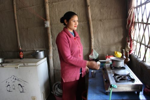 Gita cooking in her fast food restaurant