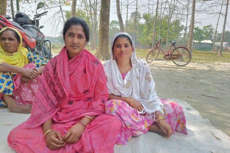 Inawara Khatun (centre) and her family choose to stay in the village of Rupakuchi in Assam, despite the financial hardships and emotional distress brought by flooding. She says migrating would meaning losing the social relationships and networks that help her survive in the aftermath of disasters.